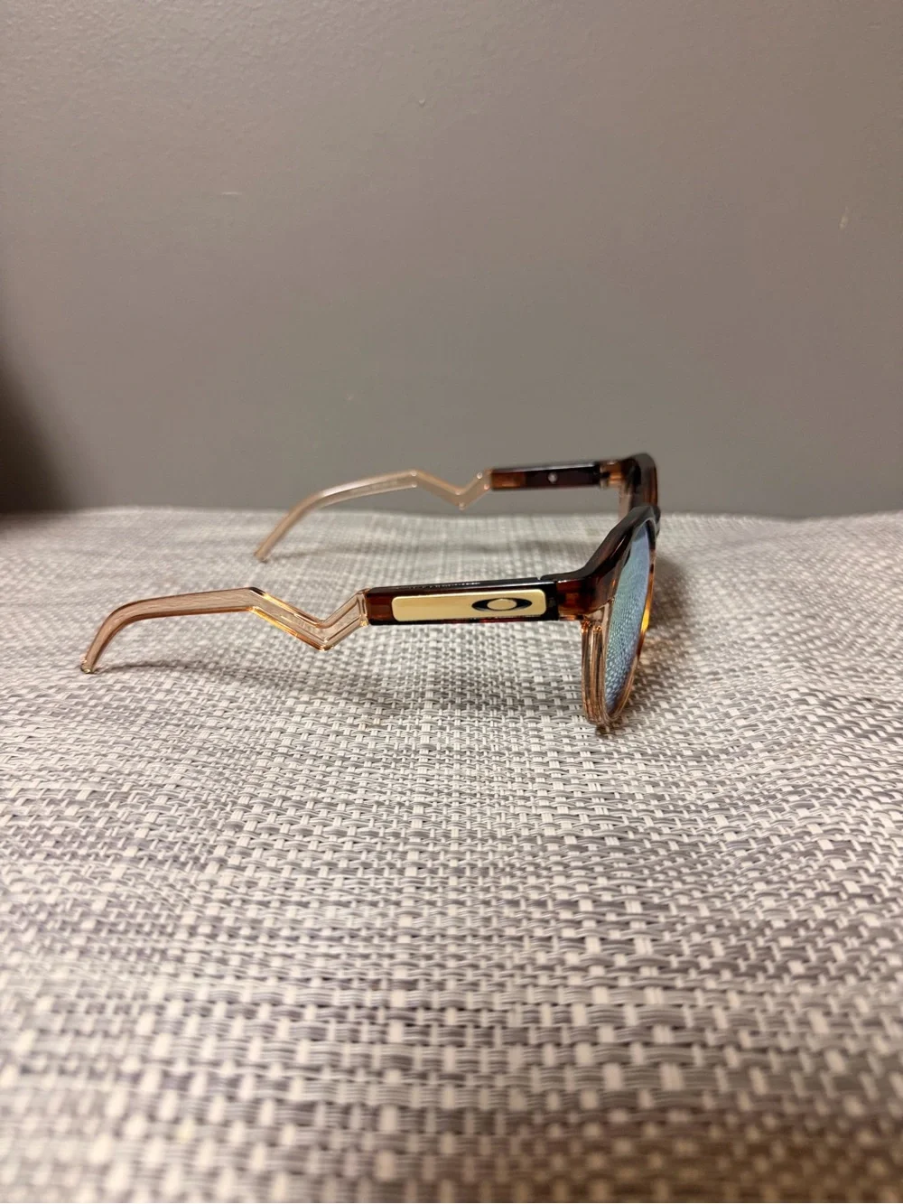 Oakley Tortoiseshell Frame Sunglasses with Blue Lenses